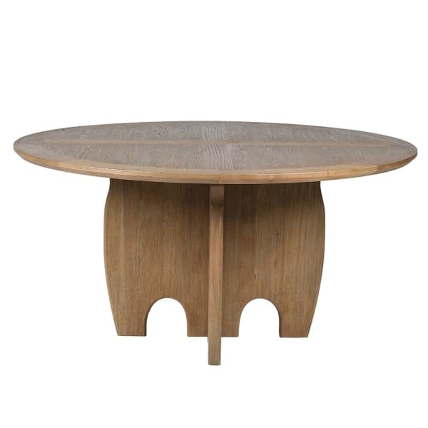 Round oak dining table with decorative pedestal base