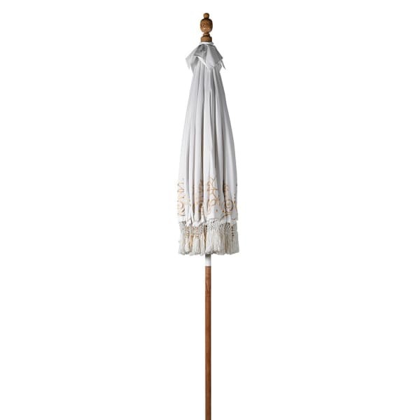 Elegant white parasol for garden seating area