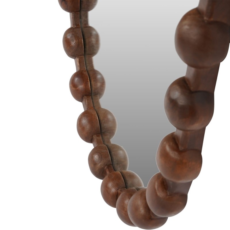 Close-up of the rounded details on the mango wood mirror frame