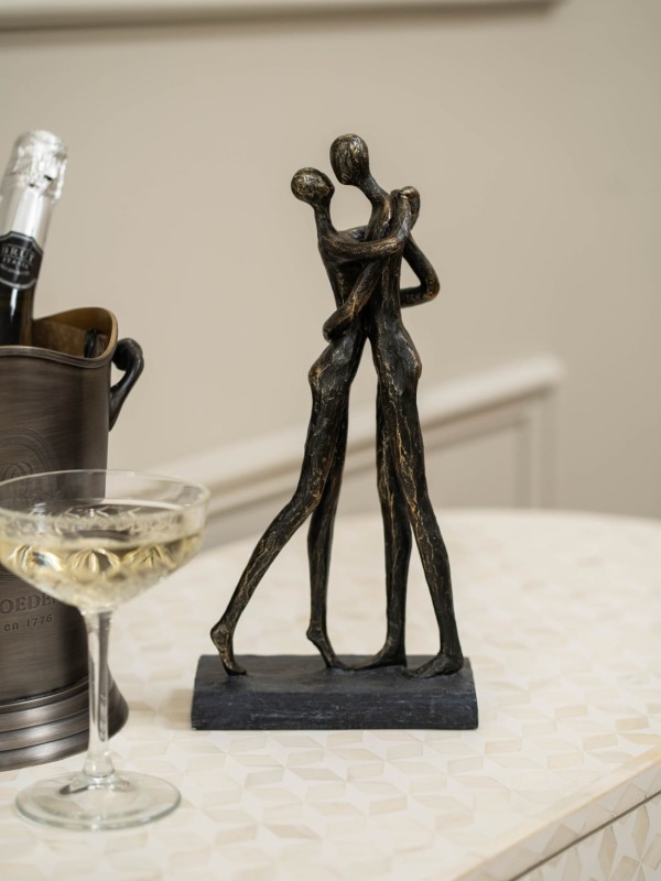 Brompton Love embracing couple sculpture measuring 32 cm high