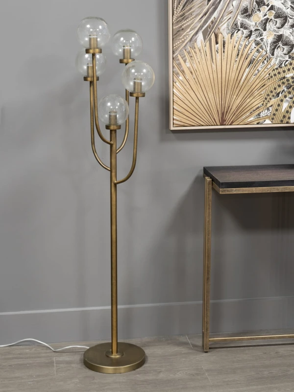 Gold metal floor lamp for a living room
