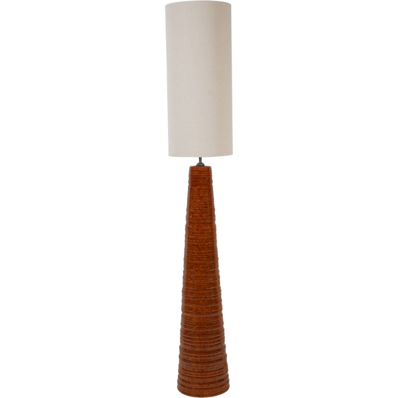 Tall terracotta floor lamp with a light linen shade