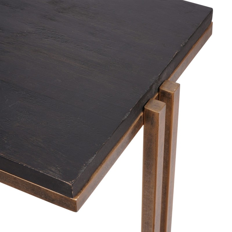 Black console table beneath a wall mirror