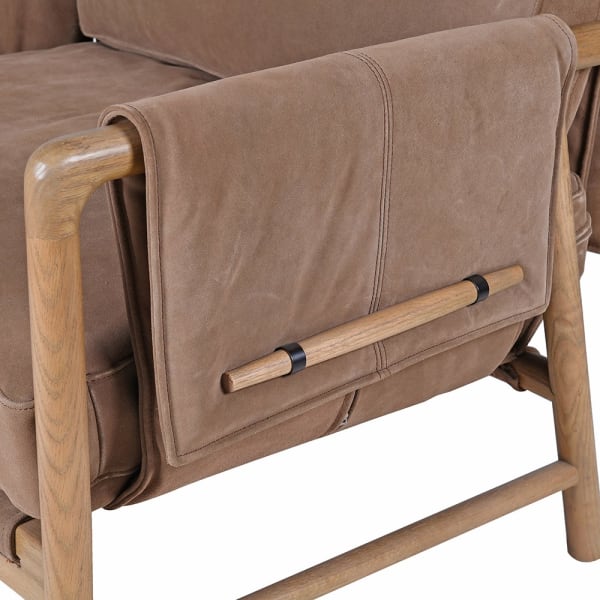 Oak-framed suede chair for a home study or library