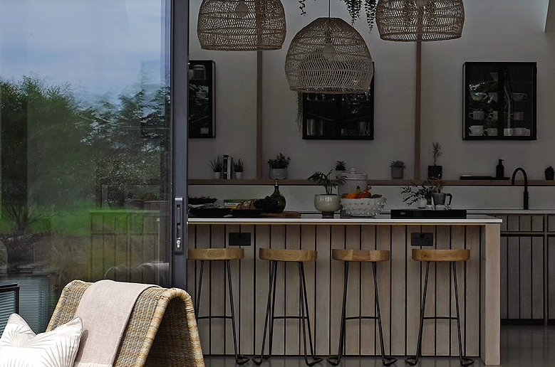 Oval pendant light with a handwoven natural rattan shade
