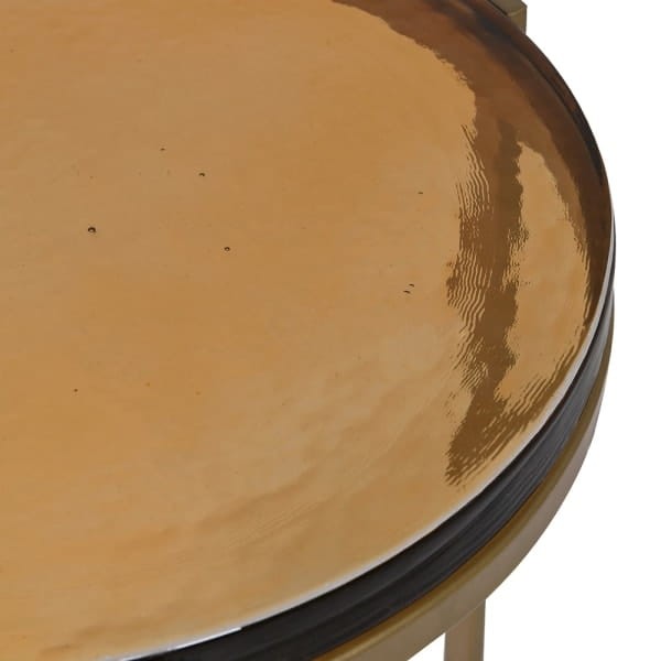 Round gold side tables with textured amber glass tops