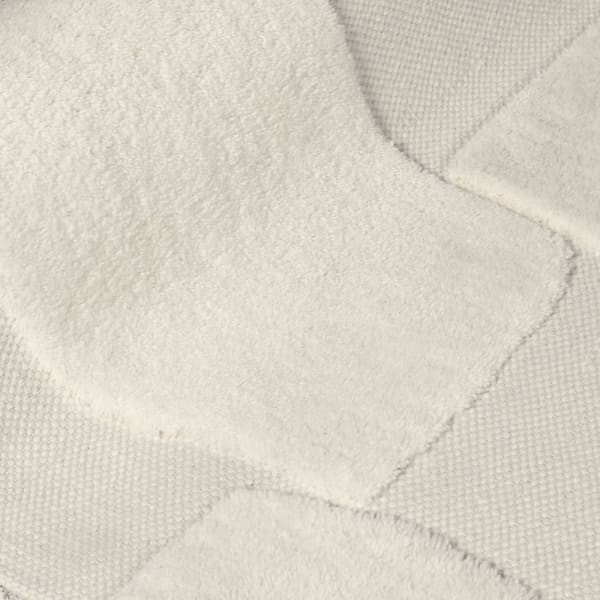 Light ecru rug crafted from wool and cotton