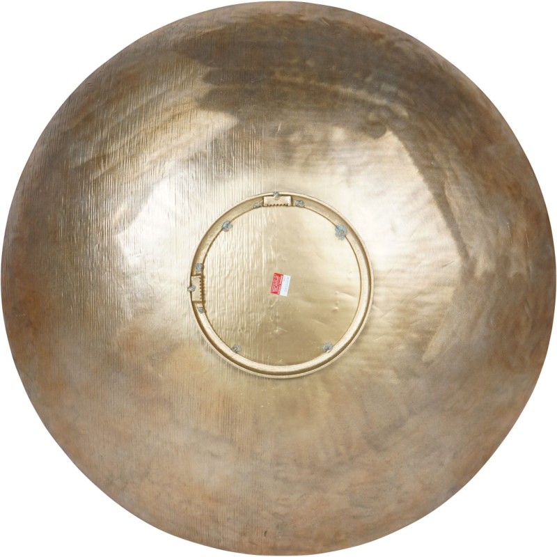 Brass wall decoration displayed above a sofa or sideboard
