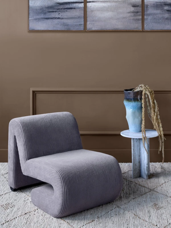 Brown accent chair for a bedroom or reading corner