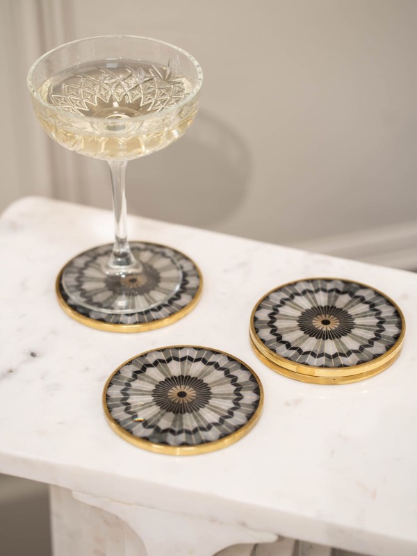 Black and white marble-effect coasters with gold edging