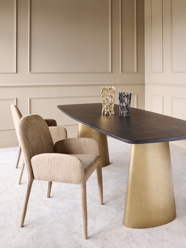 Upholstered beige dining chair with a rounded backrest