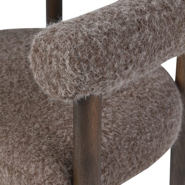 Brown carver-style dining chair with curved back