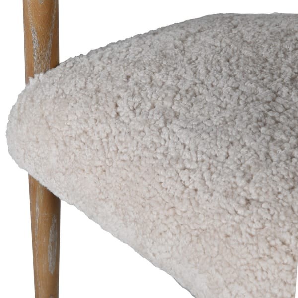 Luxury dining armchair upholstered in cream faux fur with ash wood legs