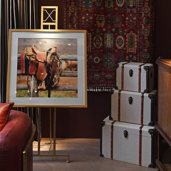 Beige storage trunks with brown straps and metal fittings
