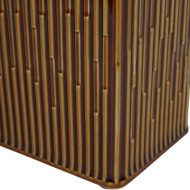 Rust ceramic vase with vertical grooves