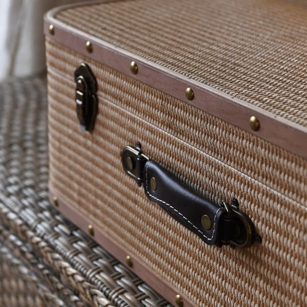 Beige Zelten trunks with brown decorative trims