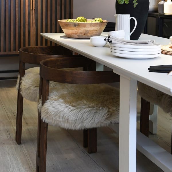 Cream sheepskin dining chair with brown oak arms