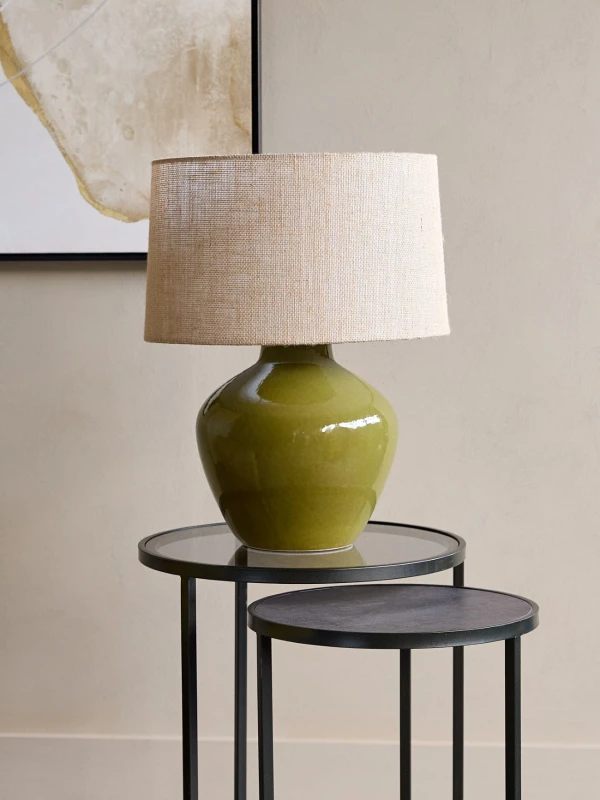 Green table lamp with a beige hessian shade