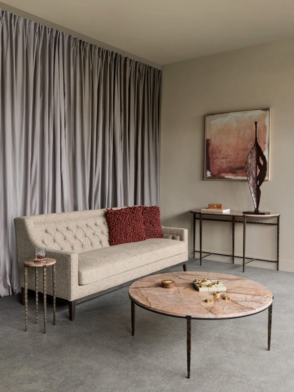 Tall abstract sculpture displayed on a console table
