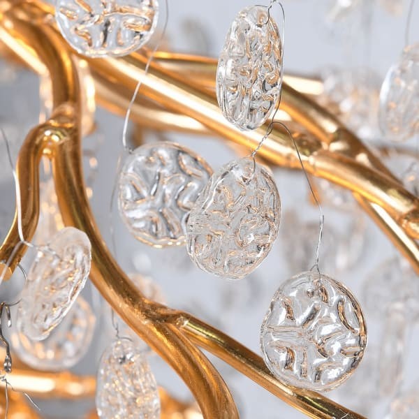 Transparent glass drops on modern gold chandelier