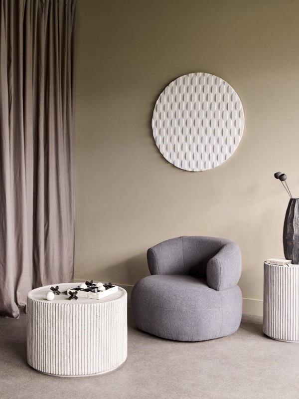 Pale round coffee table with cylindrical form