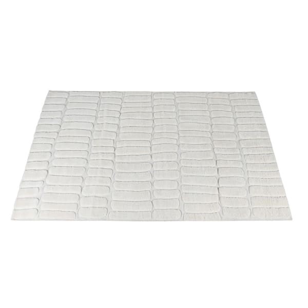 White wool rug with subtle geometric pattern