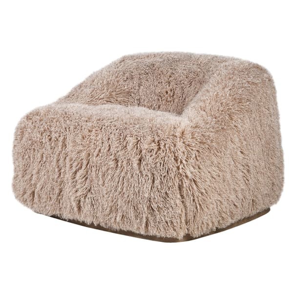 Lyall Fluffy armchair with a light upholstered seat, a distinctive curved shape and a wooden base