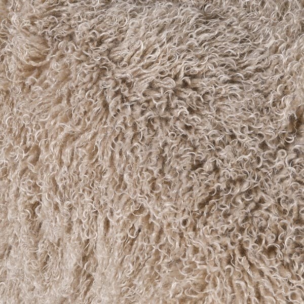 Lyall Fluffy armchair with a light upholstered seat, a distinctive curved shape and a wooden base