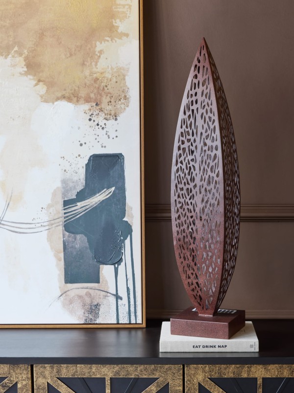Iron garden sculpture with integrated solar lighting