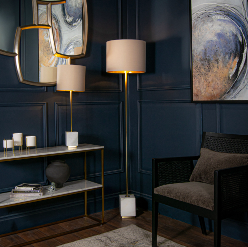 Brass-toned floor lamp with a light marble base