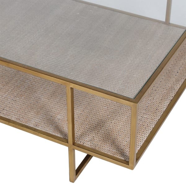 Glass tabletop detail of gold coffee table
