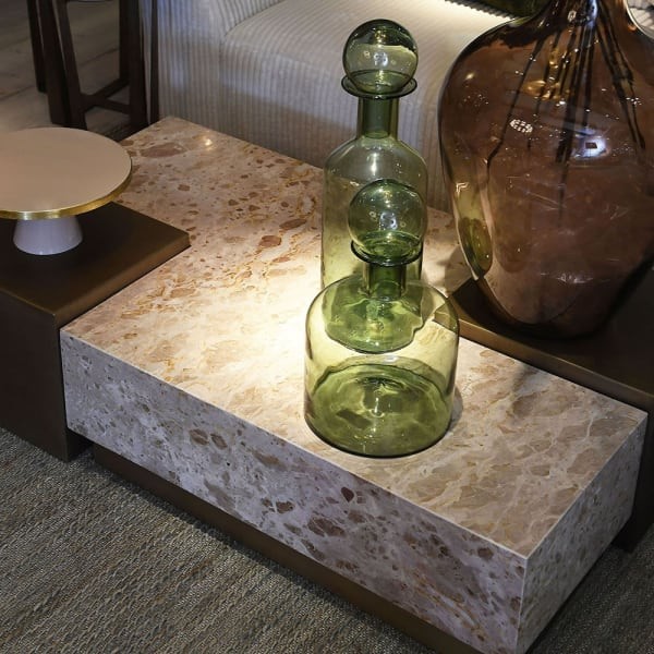 Cream marble coffee table with dark-gold side modules