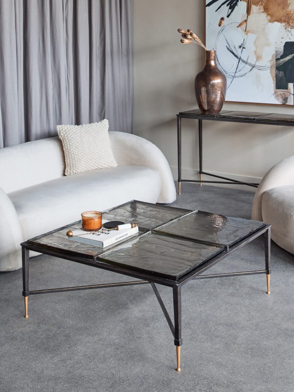 Square Stella coffee table, 98 cm, with a glass top and black and gold iron base.