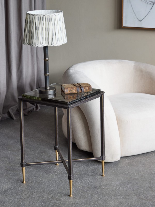 Square Stella side table, 60 cm, featuring a glass top and a black and gold iron base.