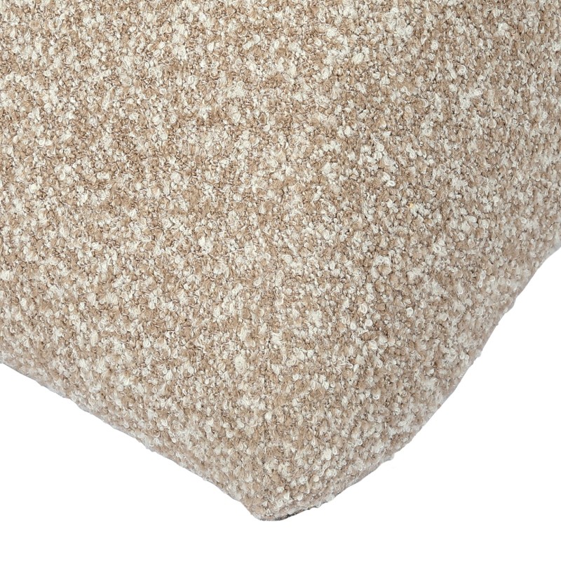 Modal bouclé armchair with footstool in beige and brown. Modern lounge chair.