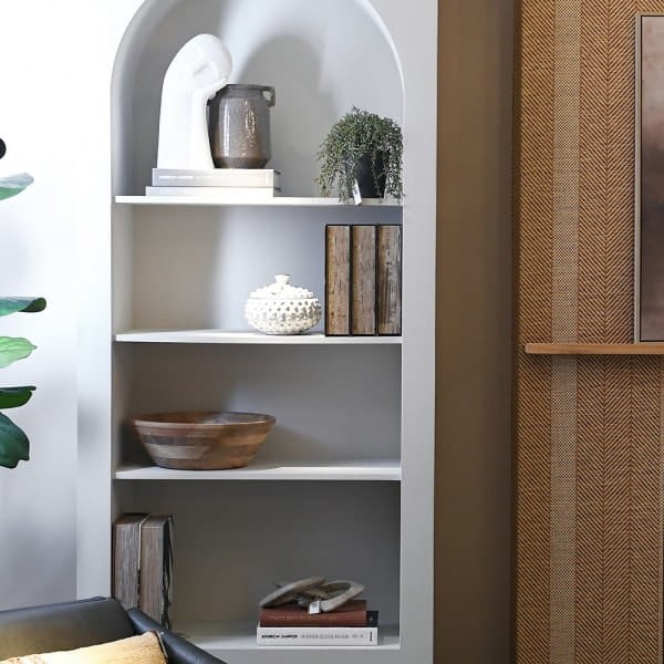Arched white bookcase with a closed design and four shelves. A tall 230 cm storage cabinet with an elegant arch shape, ideal for modern interiors.