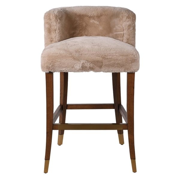 Lyall bar stool with faux shearling upholstery and an oak base. A stylish and comfortable bar stool for kitchen islands and modern interiors.