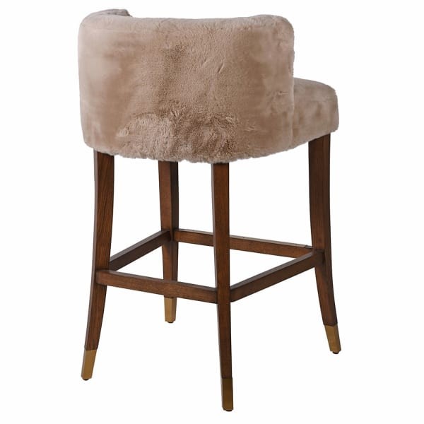 Lyall bar stool with faux shearling upholstery and an oak base. A stylish and comfortable bar stool for kitchen islands and modern interiors.