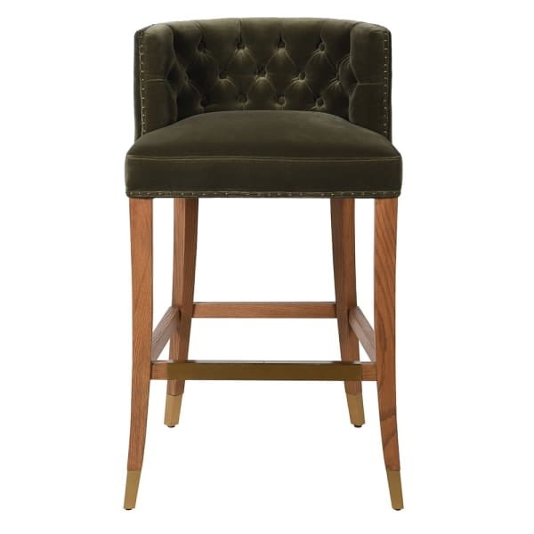 Green bar stool with tall upholstered backrest and oak legs