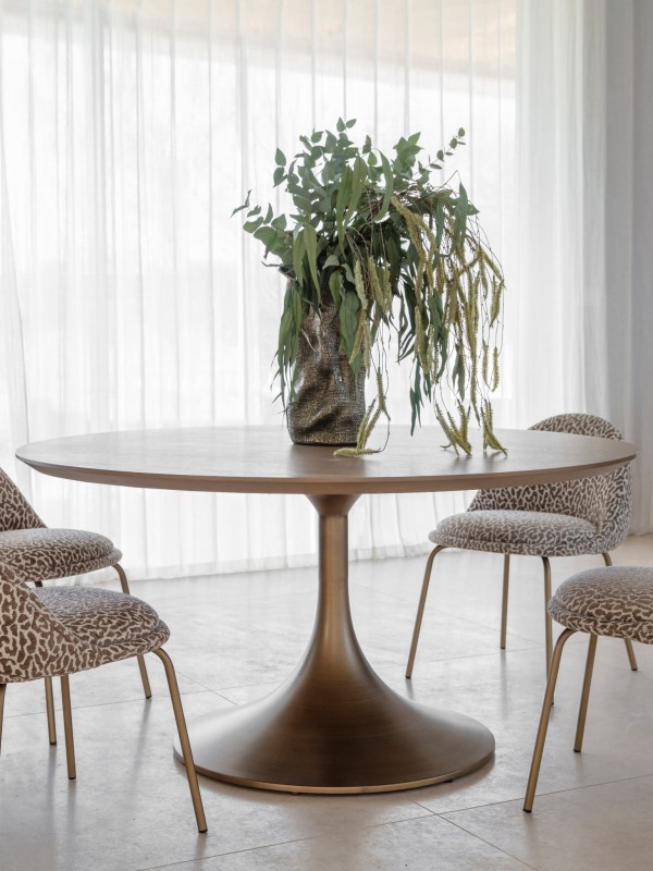 Animal Print chair with patterned upholstery and elegant gold legs. A bold accent piece for modern interiors.