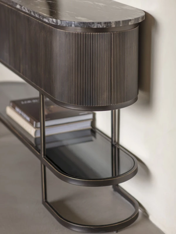 Black marble console table styled in refined living room