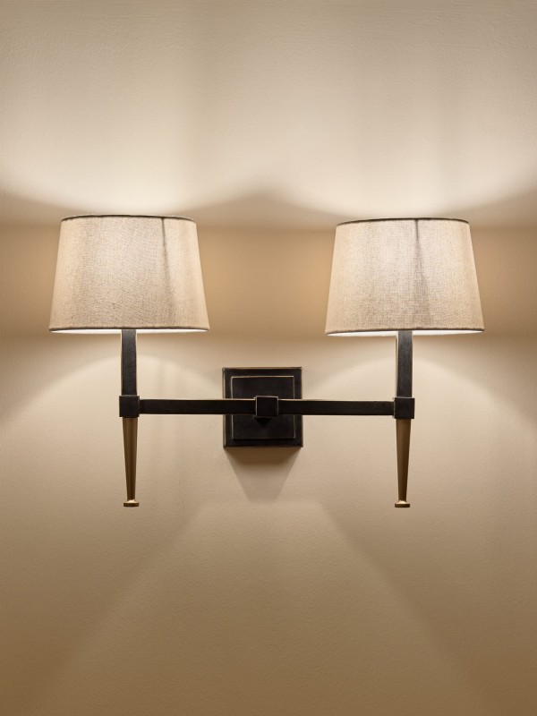 Stella wall light with two arms in black and gold, featuring two linen shades.