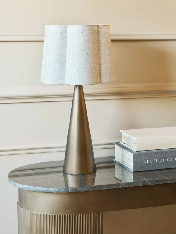 Gold table lamp with smoked-gold iron base and linen lampshade