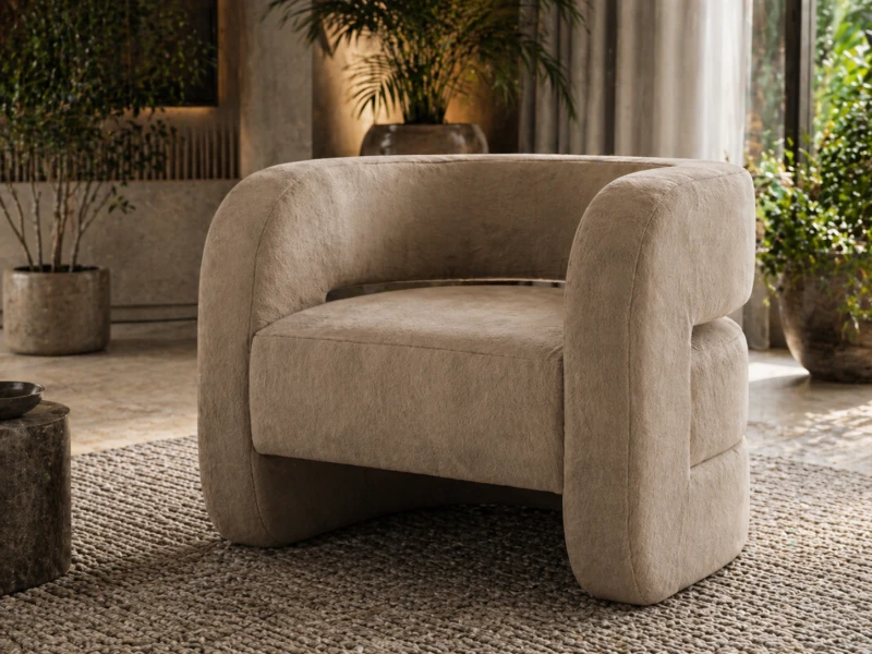 Cream velvet armchair with curved organic shape for a luxury living room