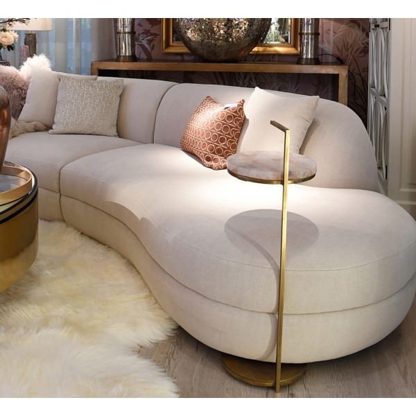 Light organic shaped sofa with pale textured upholstery