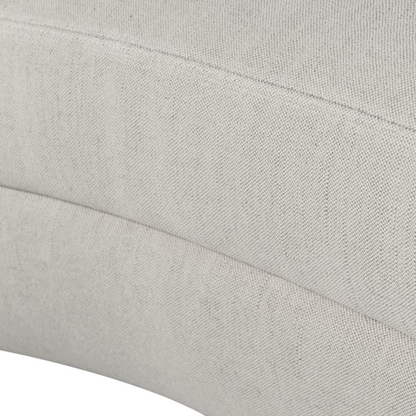 Light organic shaped sofa with pale textured upholstery