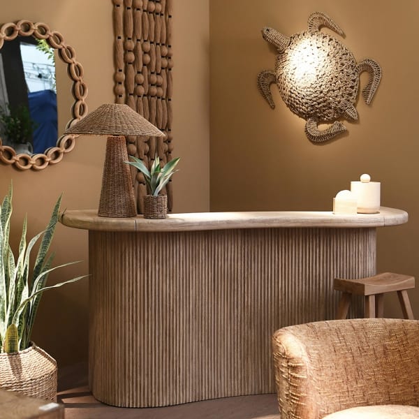 Large wooden home bar with a fluted curved front