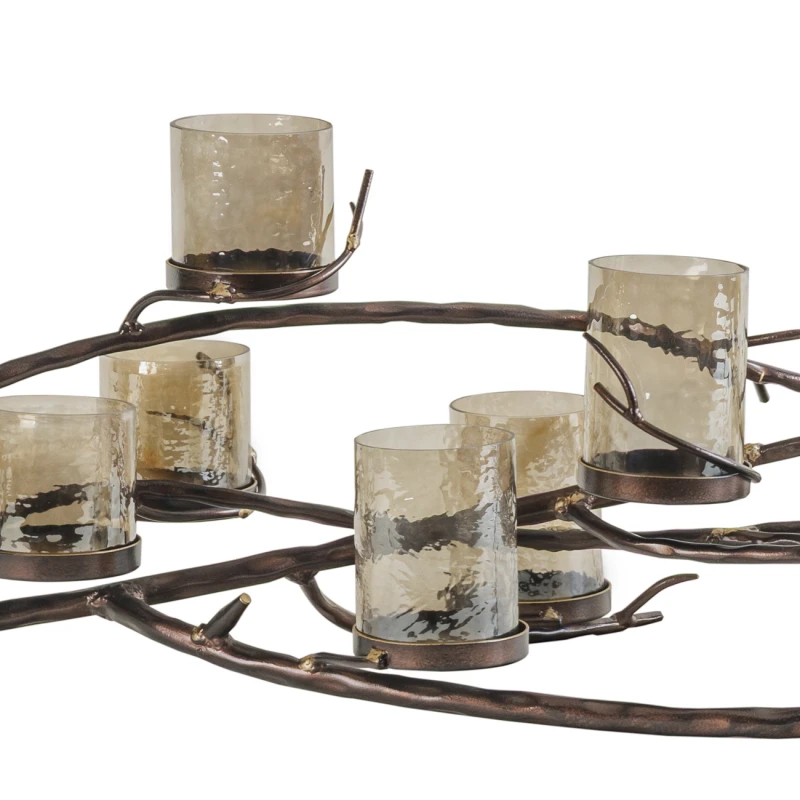 Sculptural bronze candle holder with eleven textured glass votives