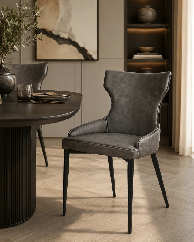 Grey faux leather dining chair with black steel legs for a luxury dining room