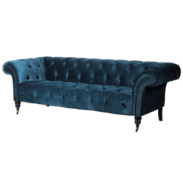 Blue velvet sofa with deep-buttoned seat and back
